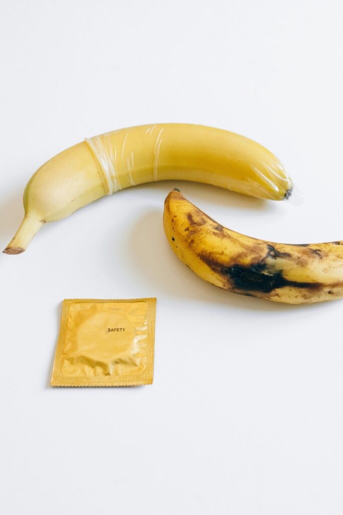 pexels-photo-5187875-5187875 Two bananas and a condom illustration promoting safe sex education.